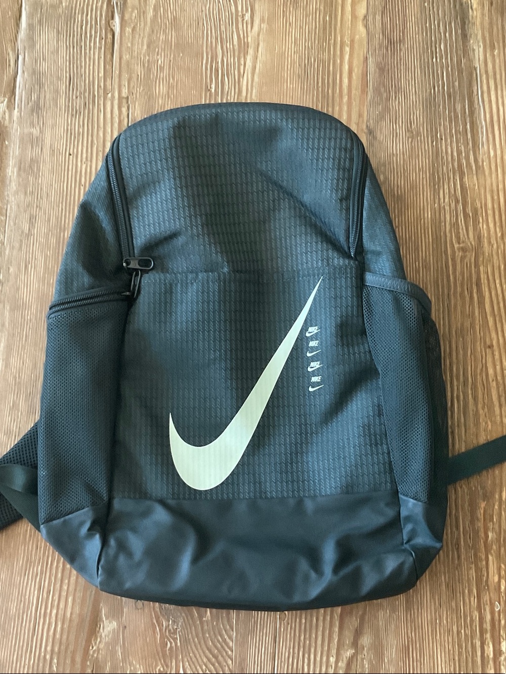 Nike lightweight charcoal gray Backpack with White Swoosh Accent